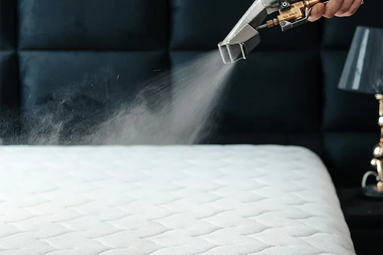 Steam cleaning a mattress